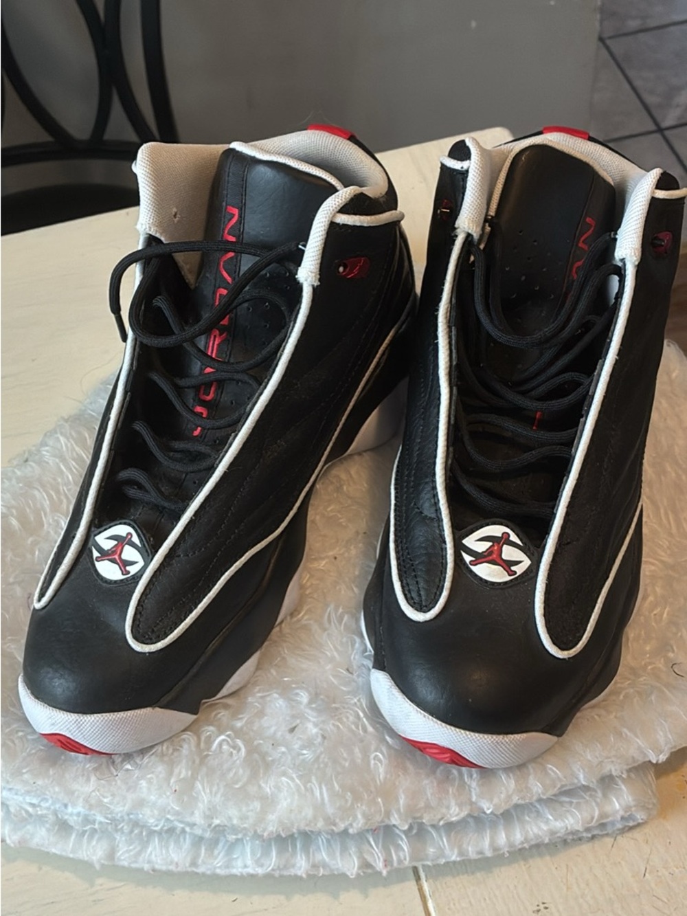Boys Jordan’s Black and White High-Top Sneakers with Red Accents